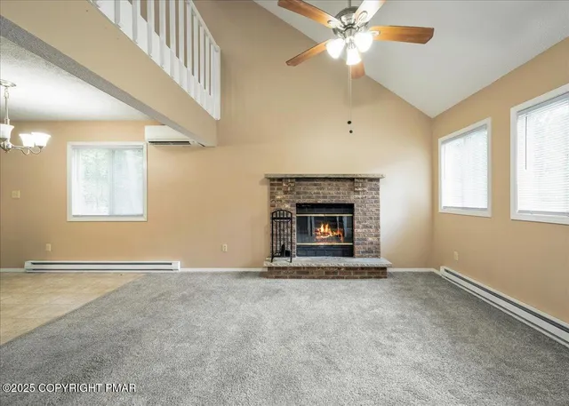 a view of a dining room with furniture wooden floor and chandelier
