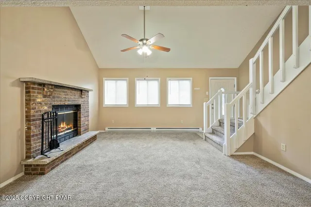 a view of an empty room with glass door and balcony