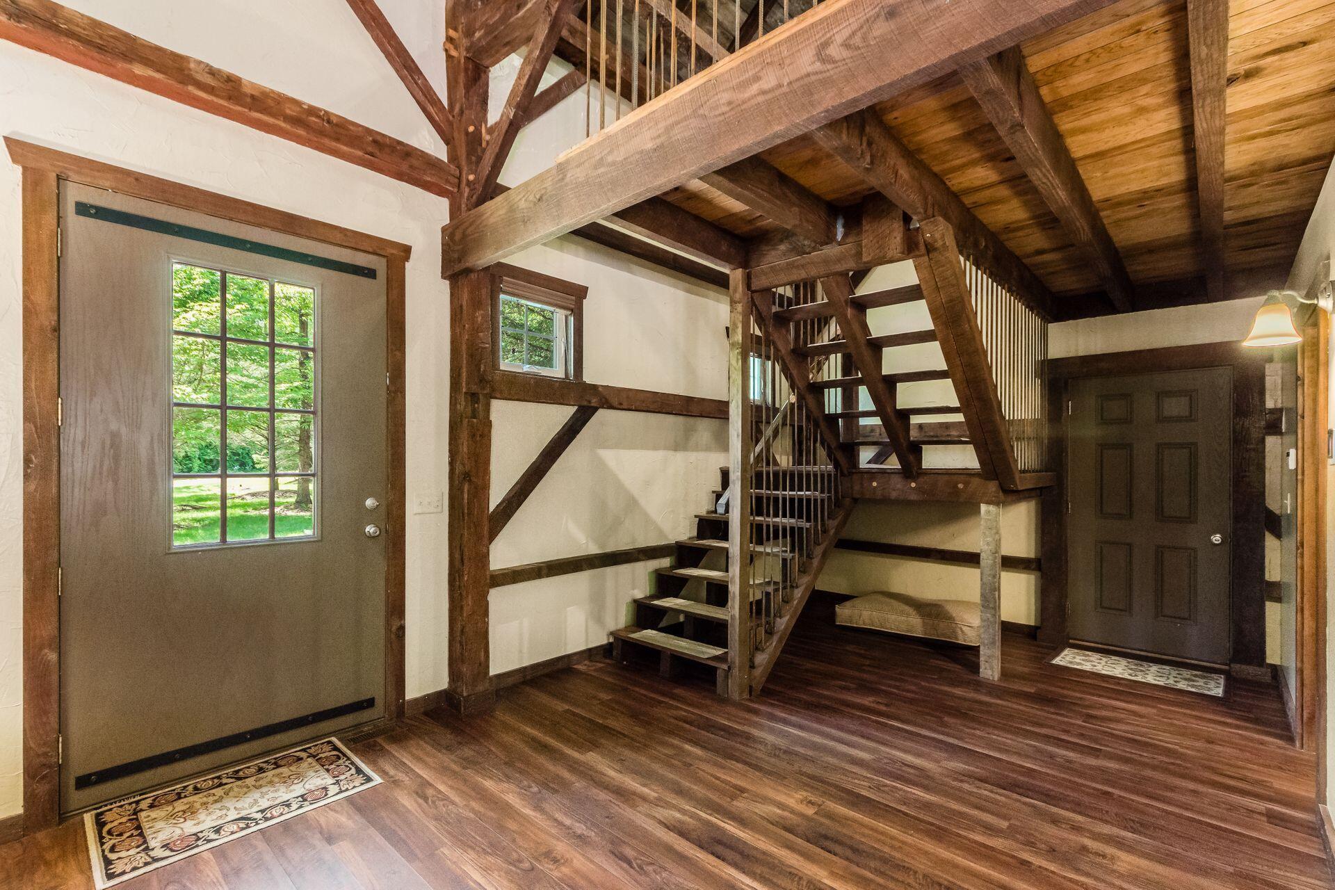 11444 Hazel Dell Road Howard, OH 43028 - Photo 9 of 41 Clever open staircase tucked into the corner leading to the loft & bedroom/bathroom.