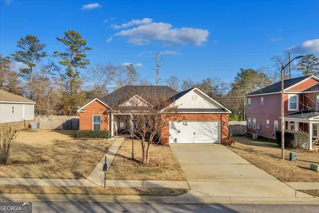 a view of a large house with a patio
