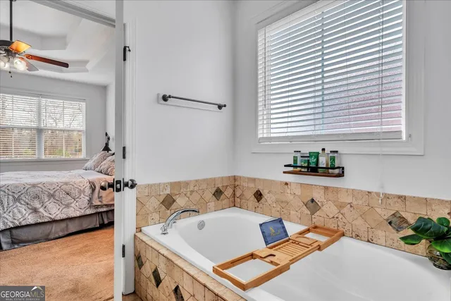 a bedroom with furniture and a wooden floor