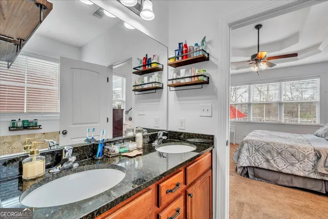 a view of walk in closet with clothes