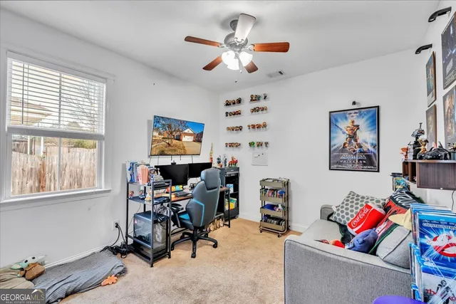 a bedroom with furniture and a book shelf