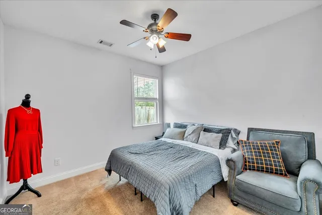 a view of a room with entryway and wooden floor