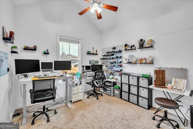 a view of a workspace with furniture