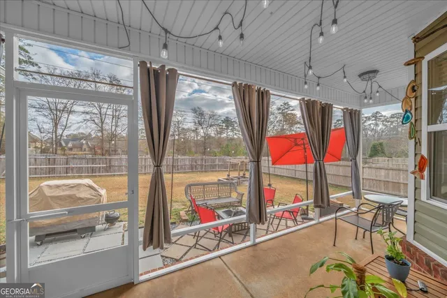 a view of a house with a yard and sitting area