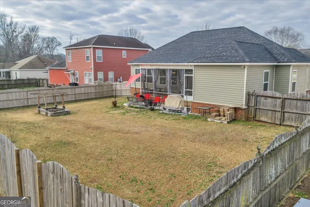a front view of house with an outdoor space