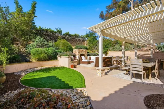 a view of a backyard with sitting area and slide