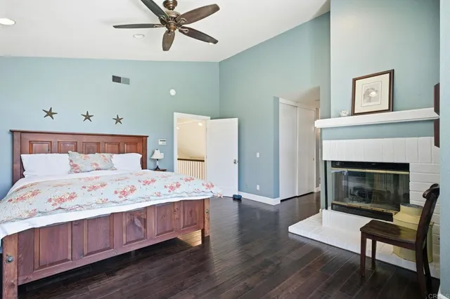 a bedroom with a bed and a fireplace