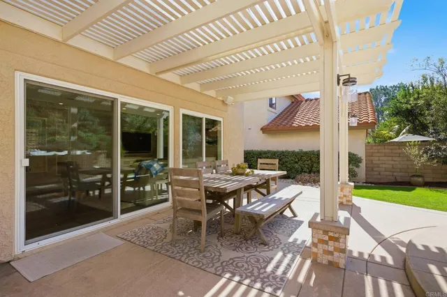 a outdoor space with lots of furniture and glass door