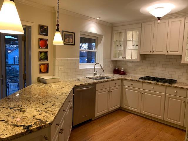 154 North Delaplaine Road Riverside, IL 60546 - Photo 8 of 26 a kitchen with granite countertop sink stove and cabinets