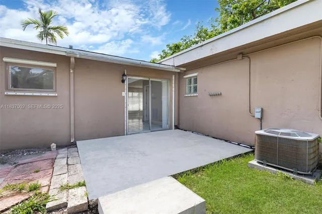 a backyard of a house with seating space