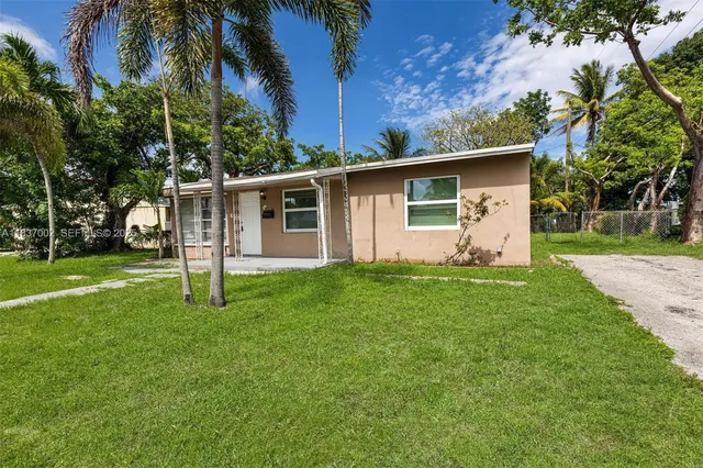 a backyard of a house with lots of green space