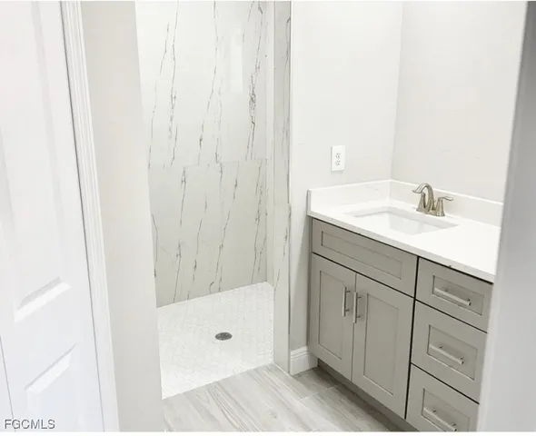 a bathroom with a sink and a mirror