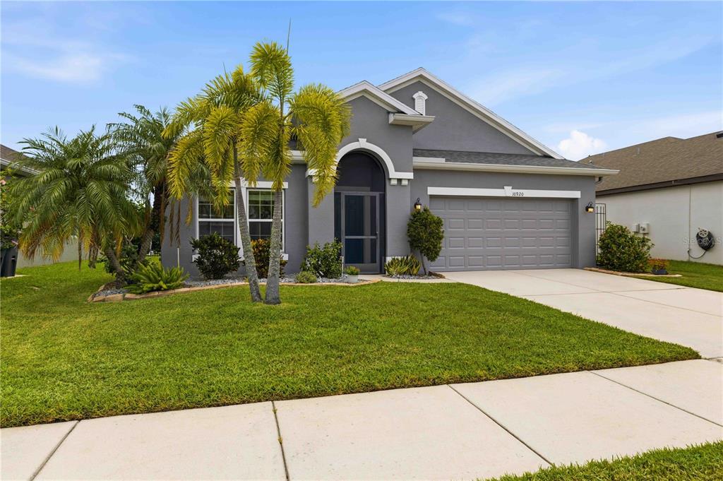 10920 79th Street East Parrish, FL 34219 - Photo 2 of 73 a front view of a house with garden