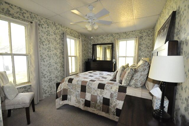 710 Short Street Streator, IL 61364 - Photo 13 of 55 a bedroom with a bed chair and window