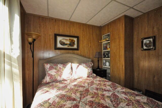 710 Short Street Streator, IL 61364 - Photo 15 of 55 a bedroom with a bed and a painting on the wall