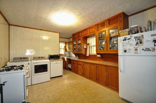 710 Short Street Streator, IL 61364 - Photo 8 of 55 a kitchen with stainless steel appliances granite countertop a stove and a refrigerator
