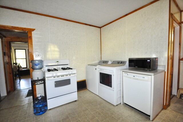710 Short Street Streator, IL 61364 - Photo 9 of 55 a white stove top oven sitting inside of a kitchen
