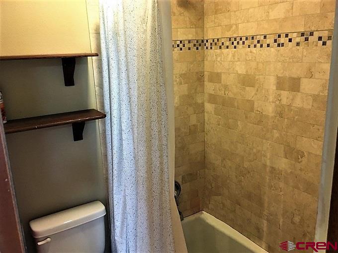 251 Gothic Road, Unit 3 Crested Butte, CO 81225 - Photo 24 of 31 updated with travertine tile