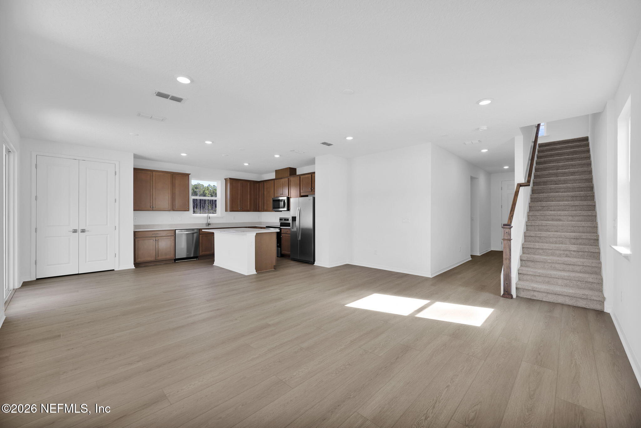 1706 Mickey Way Middleburg, FL 32068 - Photo 14 of 27 a view of a kitchen with wooden cabinet and a fireplace