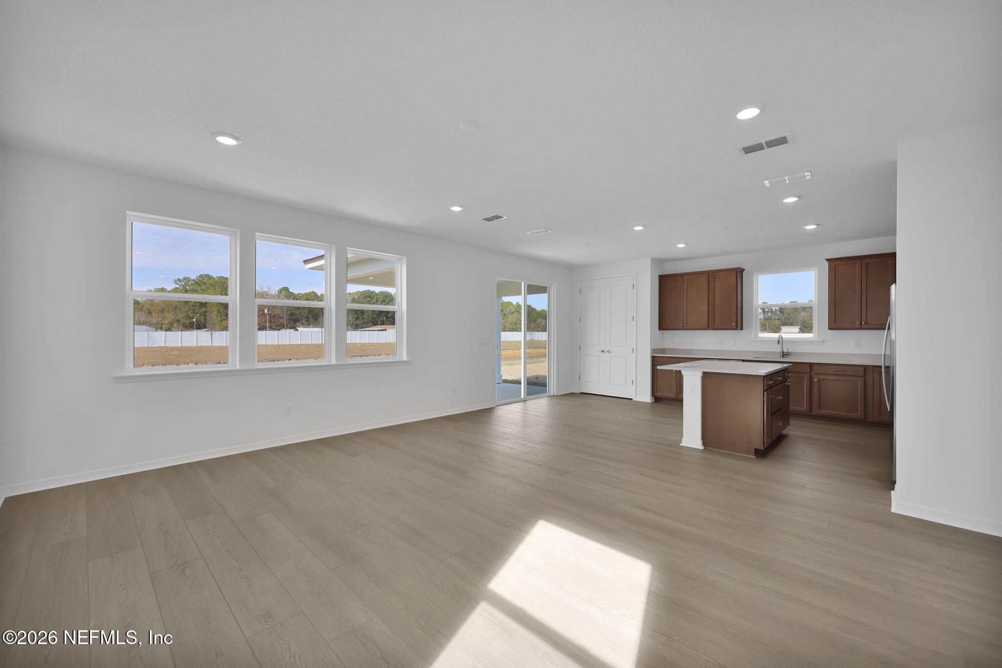 1706 Mickey Way Middleburg, FL 32068 - Photo 17 of 27 a view of kitchen with cabinets and wooden floor