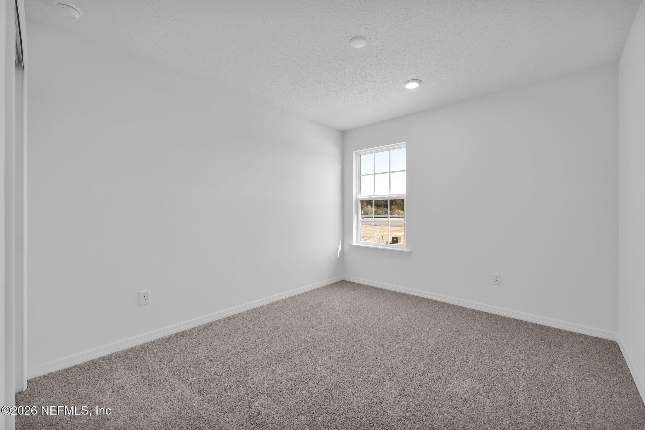 1706 Mickey Way Middleburg, FL 32068 - Photo 22 of 27 an empty room with windows