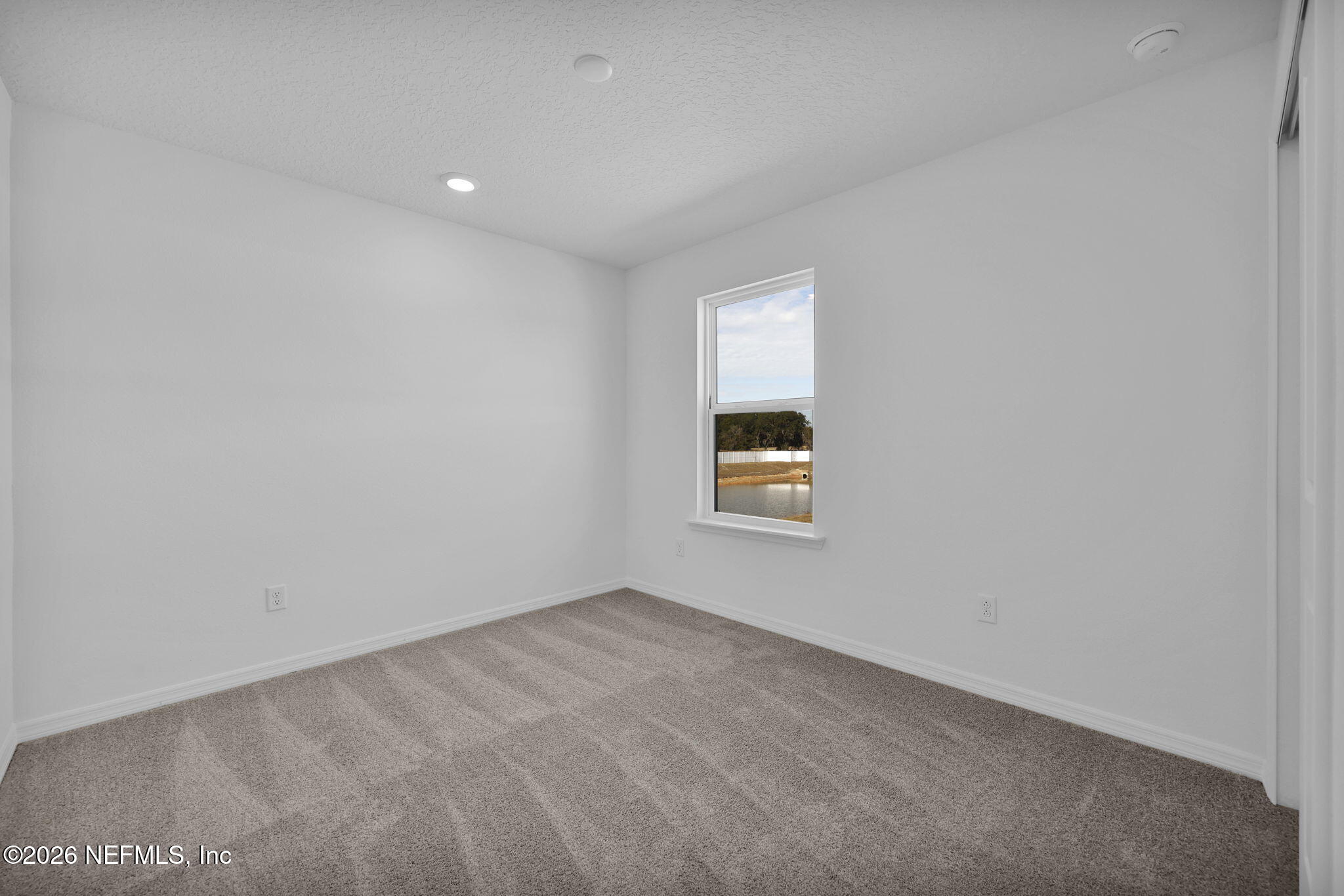 1706 Mickey Way Middleburg, FL 32068 - Photo 23 of 27 an empty room with a window