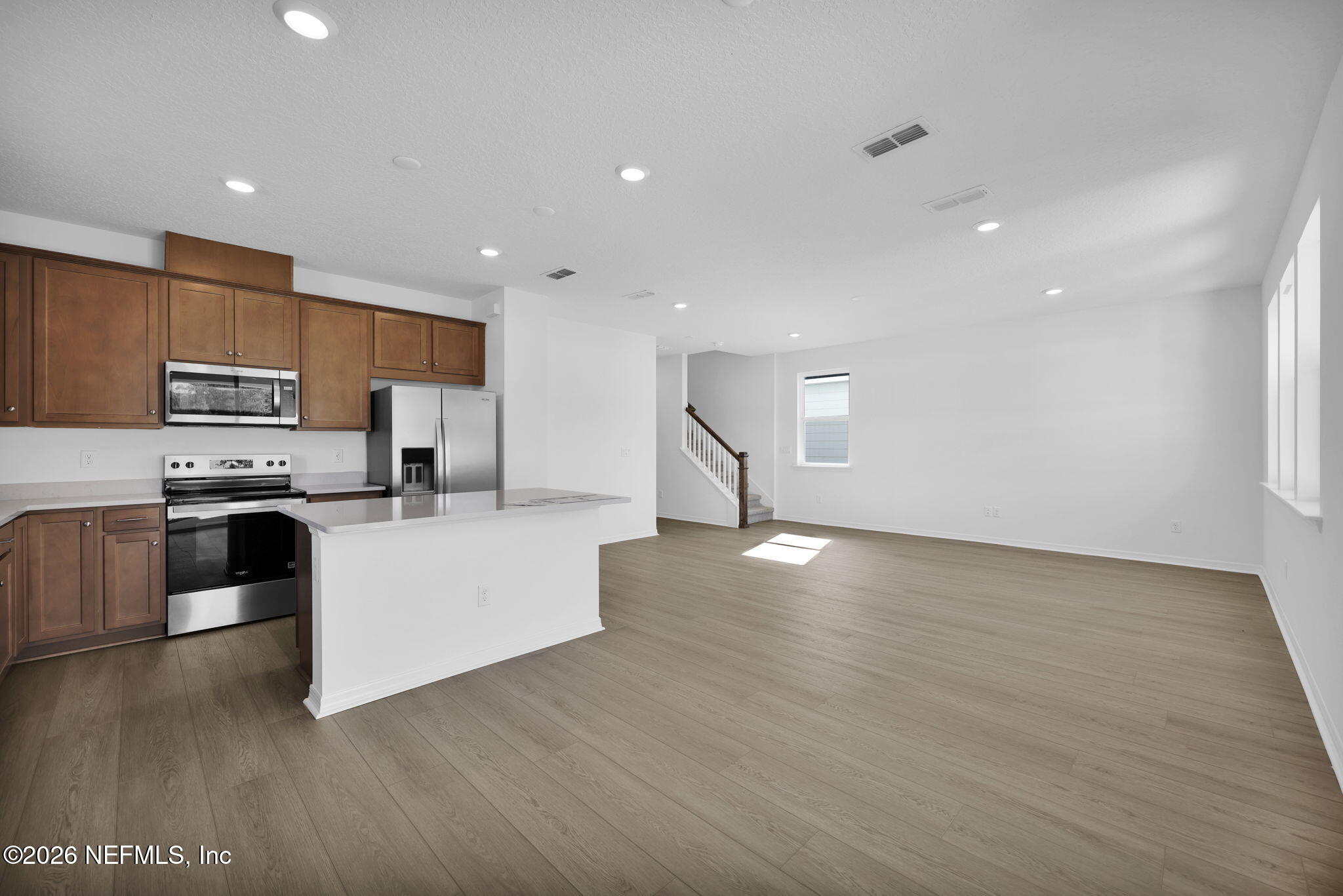 1706 Mickey Way Middleburg, FL 32068 - Photo 7 of 27 a kitchen with stainless steel appliances a refrigerator sink and stove