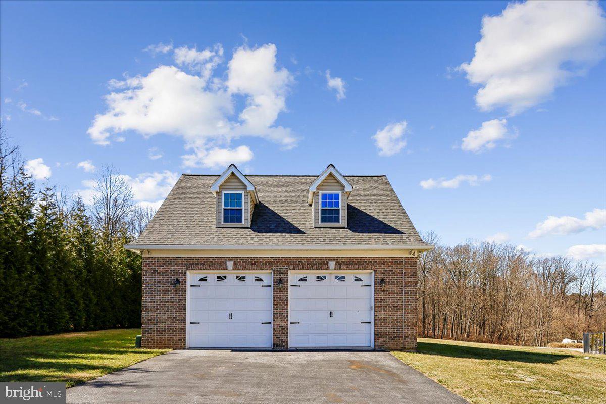 496 Leisters Church Road Westminster, MD 21157 - Photo 102 of 118 a front view of a house with a garden