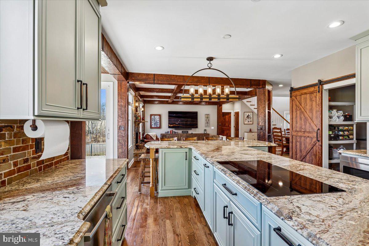 496 Leisters Church Road Westminster, MD 21157 - Photo 18 of 118 a kitchen with stainless steel appliances granite countertop a sink and a stove