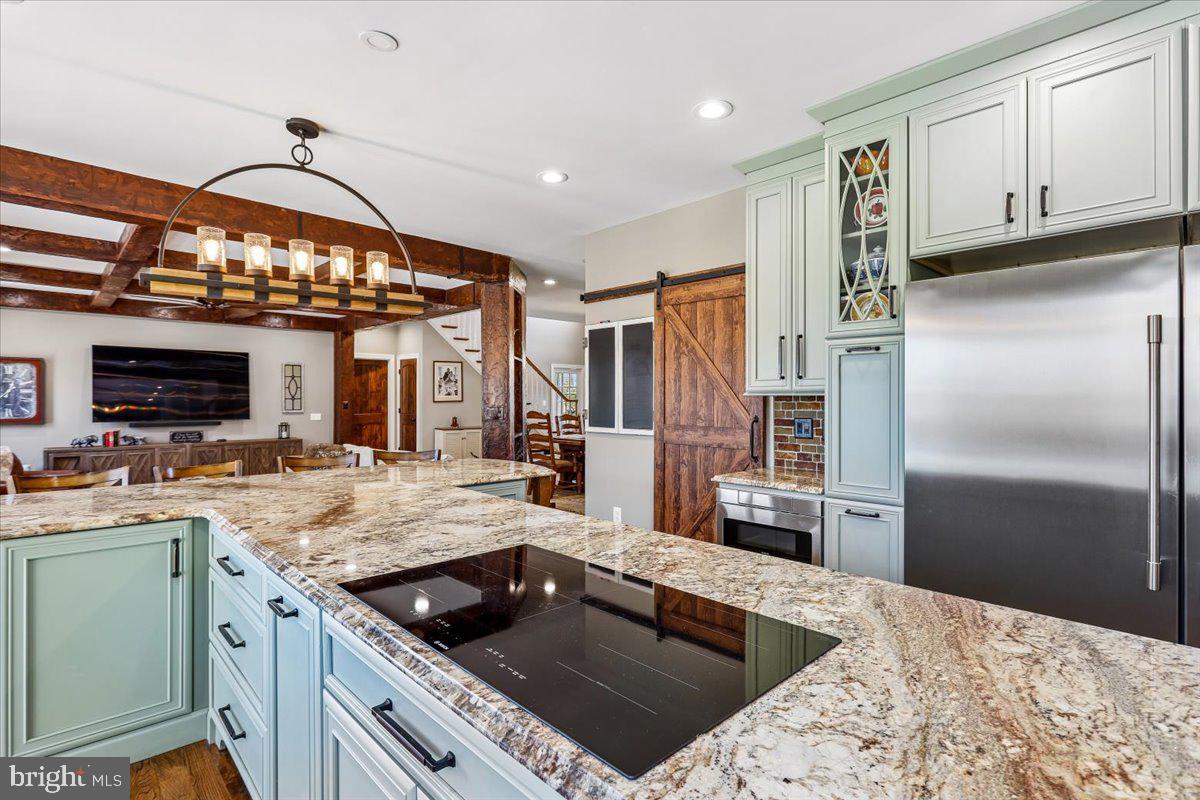 496 Leisters Church Road Westminster, MD 21157 - Photo 20 of 118 a kitchen with stainless steel appliances granite countertop a sink refrigerator and cabinets