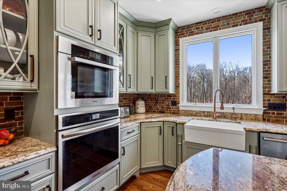 496 Leisters Church Road Westminster, MD 21157 - Photo 21 of 118 a kitchen with a stove a sink and a microwave