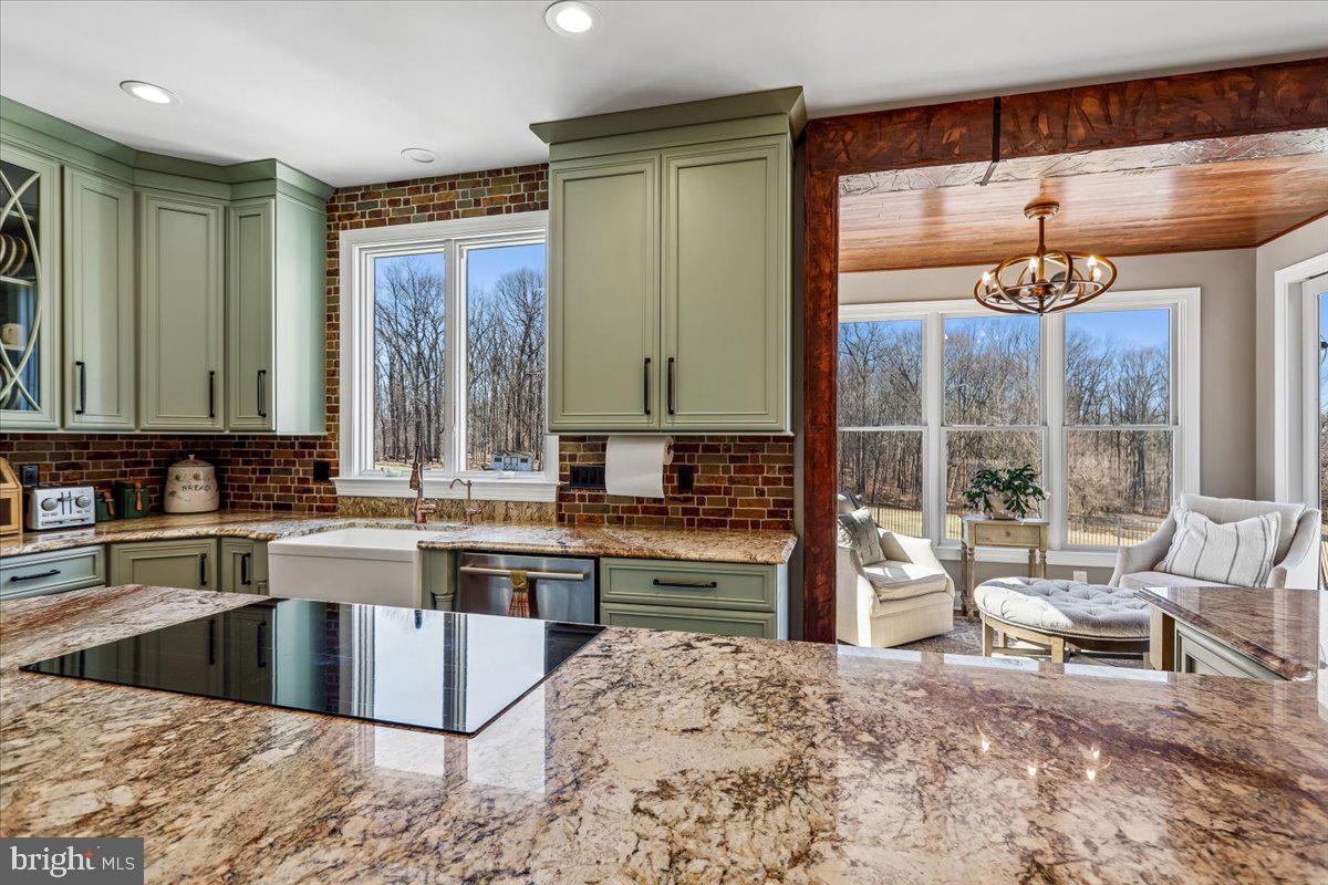 496 Leisters Church Road Westminster, MD 21157 - Photo 22 of 118 a kitchen with a stove a sink and a refrigerator