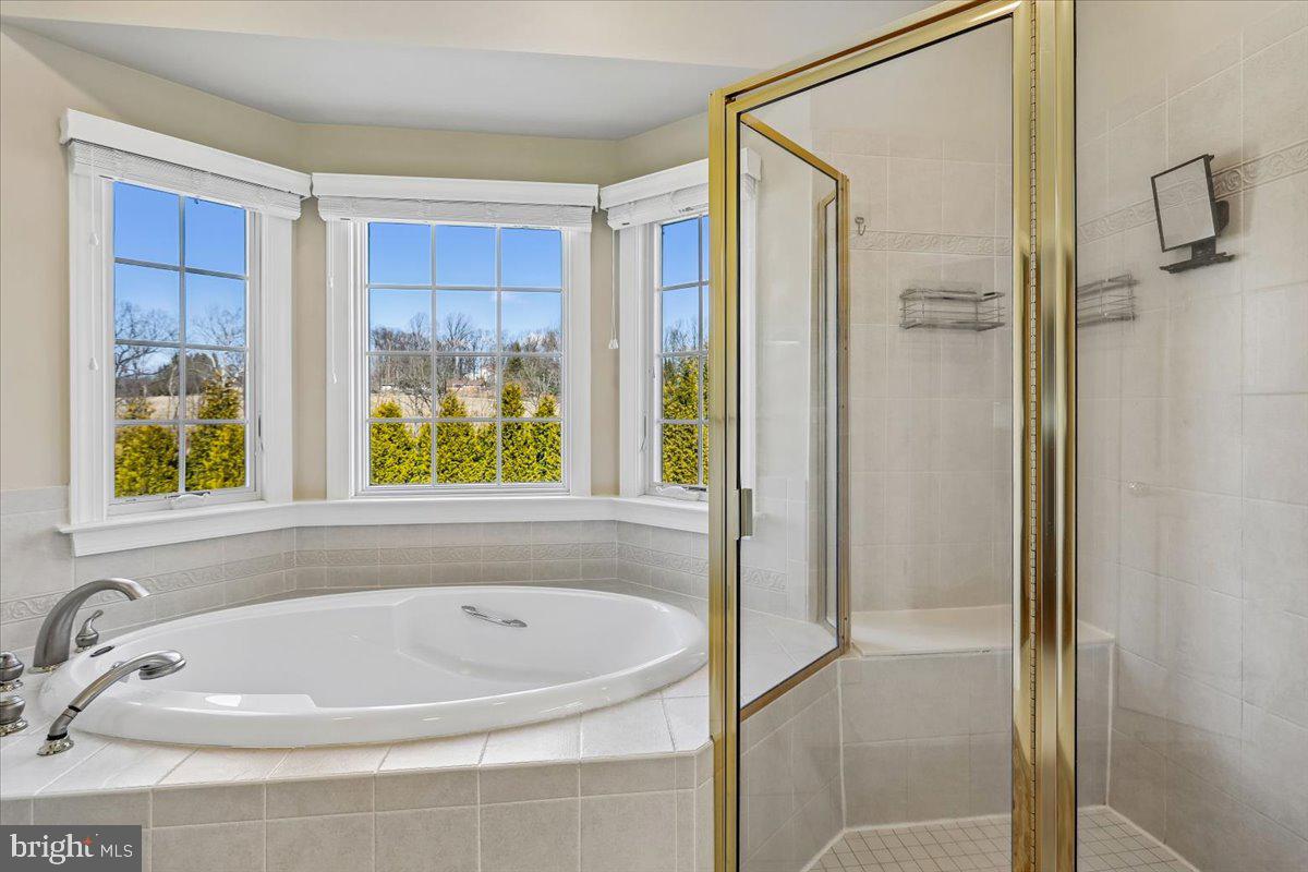 496 Leisters Church Road Westminster, MD 21157 - Photo 36 of 118 a white bath tub sitting next to a window