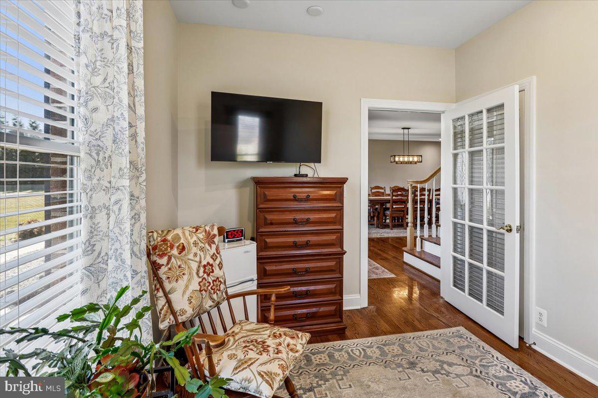496 Leisters Church Road Westminster, MD 21157 - Photo 39 of 118 a living room with furniture and a flat screen tv