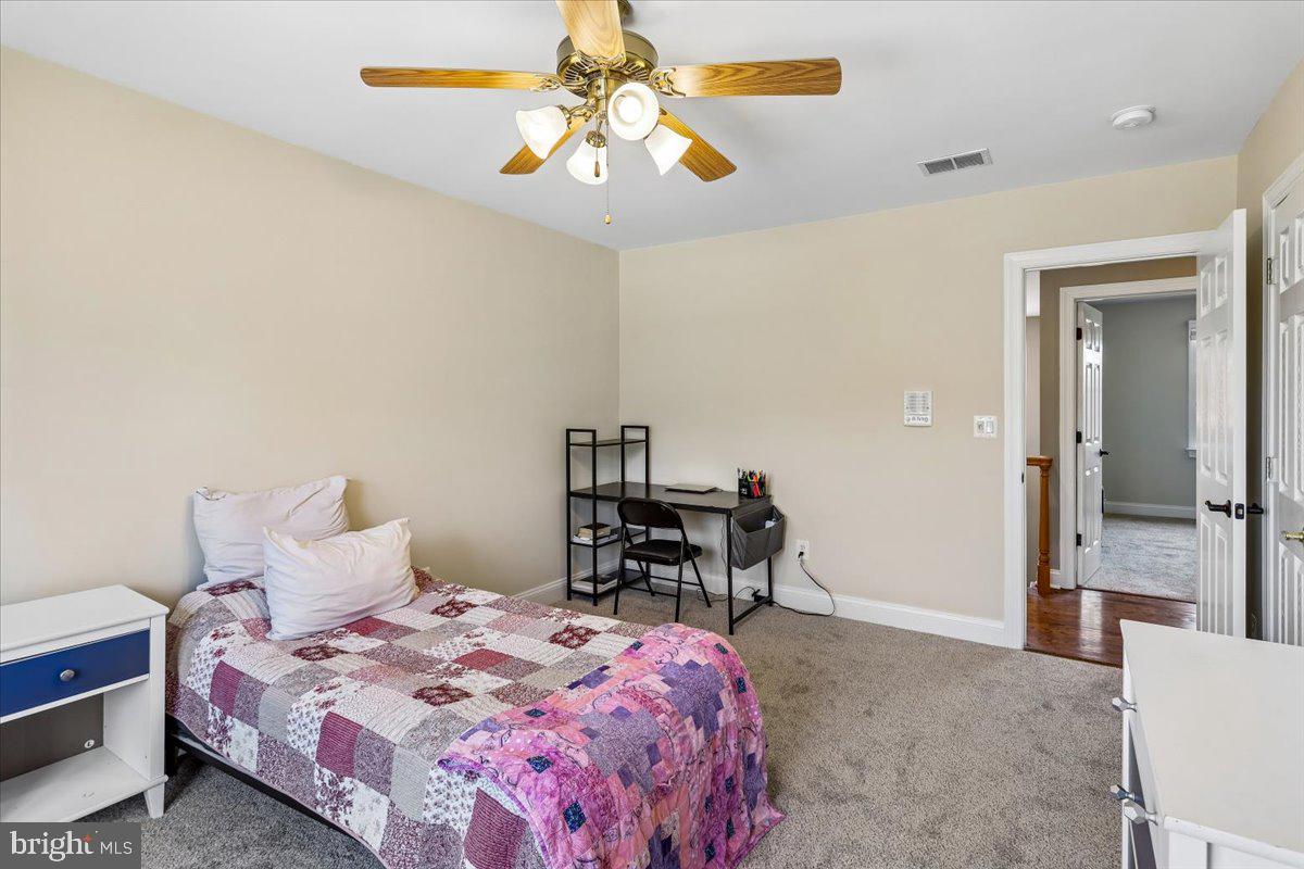 496 Leisters Church Road Westminster, MD 21157 - Photo 47 of 118 a bedroom with a bed and a table in it