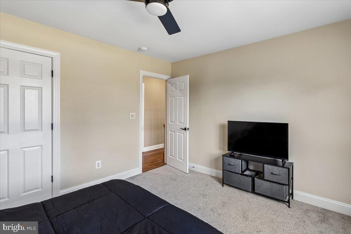496 Leisters Church Road Westminster, MD 21157 - Photo 54 of 118 a living room with furniture and a flat screen tv