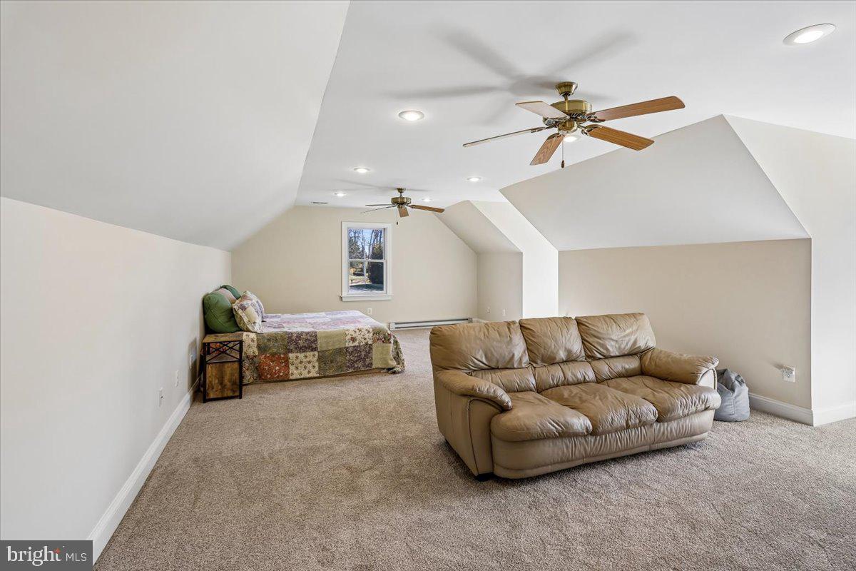 496 Leisters Church Road Westminster, MD 21157 - Photo 55 of 118 a living room with furniture and a chandelier