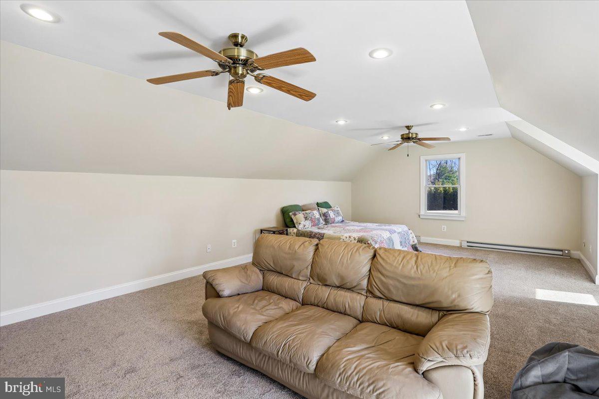 496 Leisters Church Road Westminster, MD 21157 - Photo 58 of 118 a living room with furniture and a ceiling fan