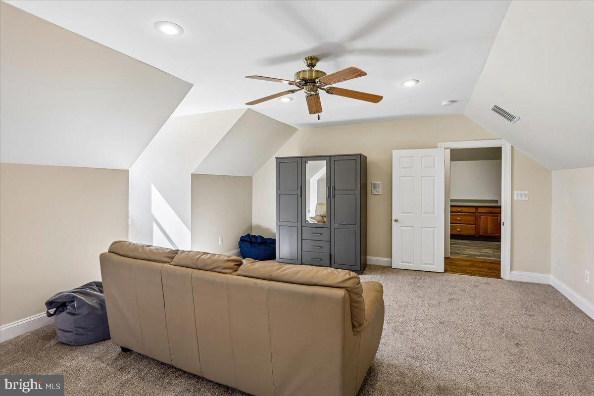 496 Leisters Church Road Westminster, MD 21157 - Photo 60 of 118 a living room with furniture and a chandelier