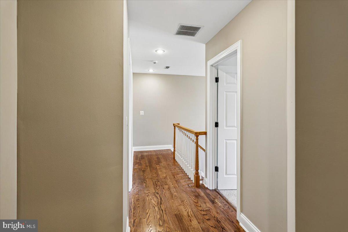 496 Leisters Church Road Westminster, MD 21157 - Photo 61 of 118 a view of a hallway with wooden floor
