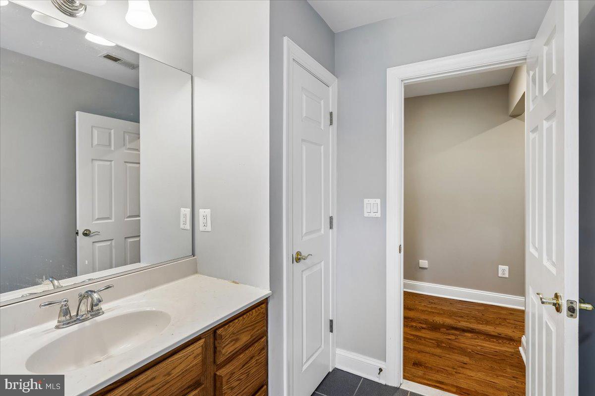 496 Leisters Church Road Westminster, MD 21157 - Photo 63 of 118 a bathroom with a sink vanity and a mirror