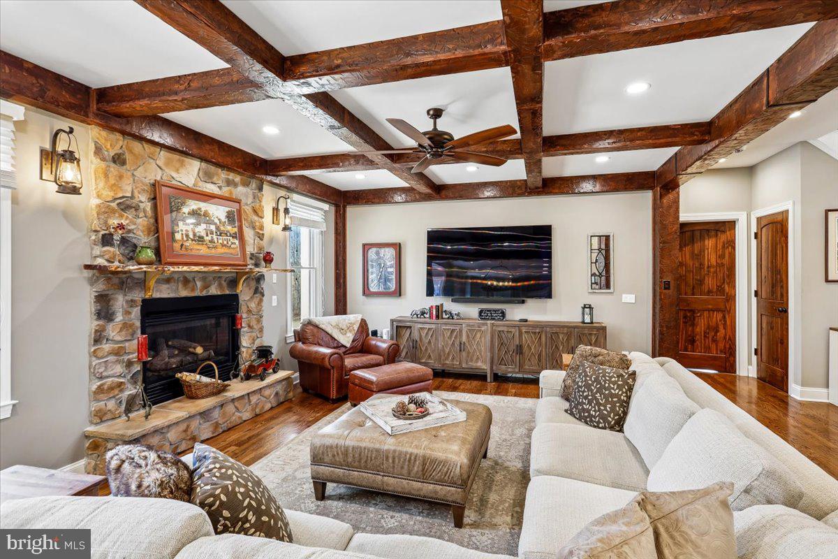 496 Leisters Church Road Westminster, MD 21157 - Photo 8 of 118 a living room with furniture a fireplace and a flat screen tv