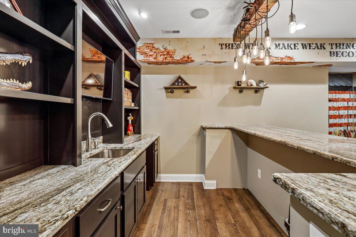 496 Leisters Church Road Westminster, MD 21157 - Photo 81 of 118 a kitchen with stainless steel appliances granite countertop a sink and wooden cabinets