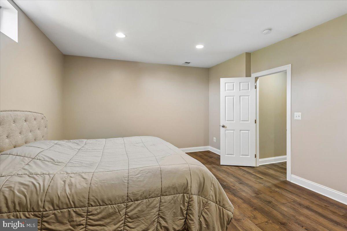 496 Leisters Church Road Westminster, MD 21157 - Photo 86 of 118 a bedroom with a bed and a painting on the wall