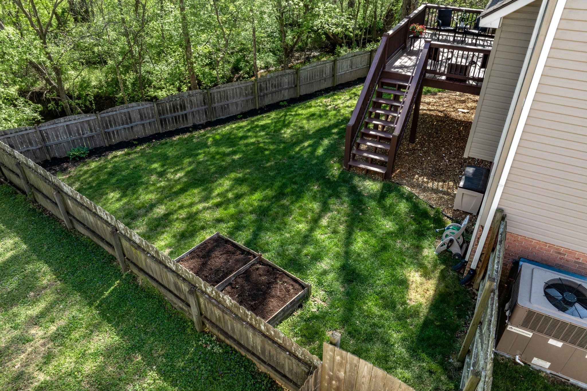 2102 Burgess Lane Spring Hill, TN 37174 - Photo 32 of 45 a view of a yard with chairs and wooden fence