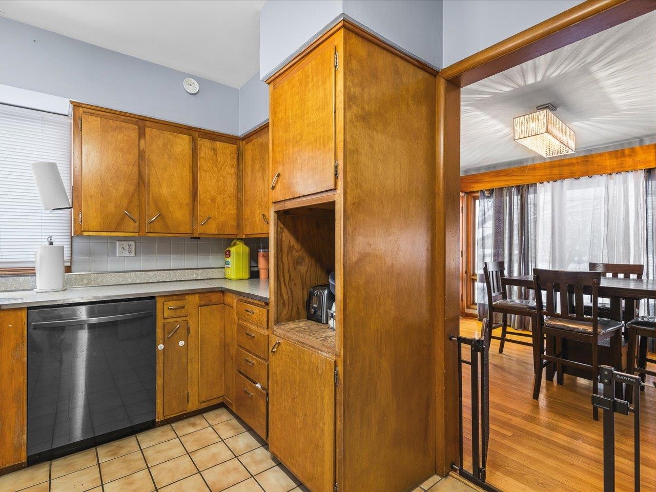 3215 Rural Street Rockford, IL 61107 - Photo 14 of 25 a kitchen with granite countertop a refrigerator a stove and a dining table