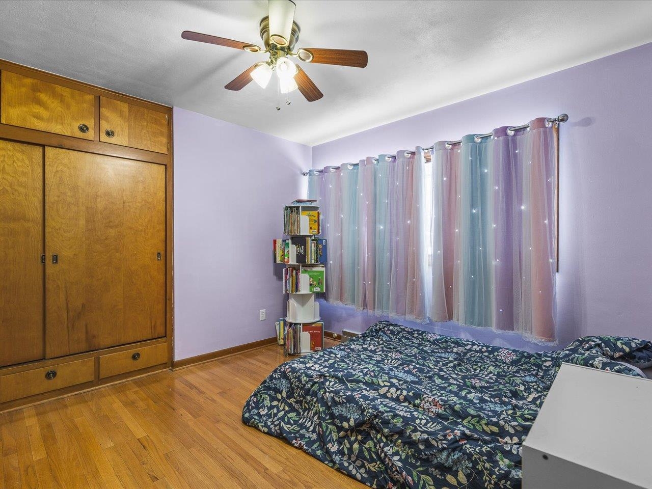 3215 Rural Street Rockford, IL 61107 - Photo 16 of 25 a bedroom with a bed and a chandelier