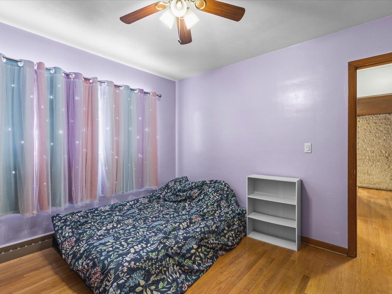 3215 Rural Street Rockford, IL 61107 - Photo 17 of 25 a room with a bed and a chandelier